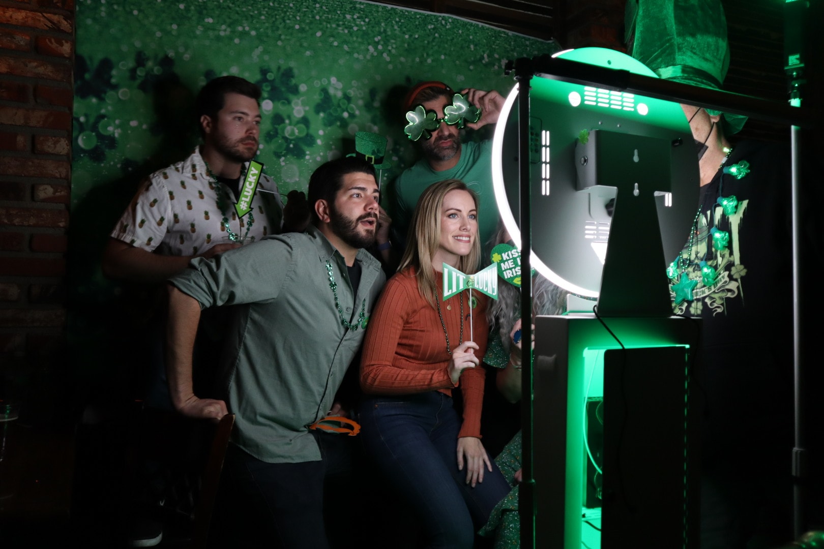 Guests having fun at a Q-It-Up photo booth